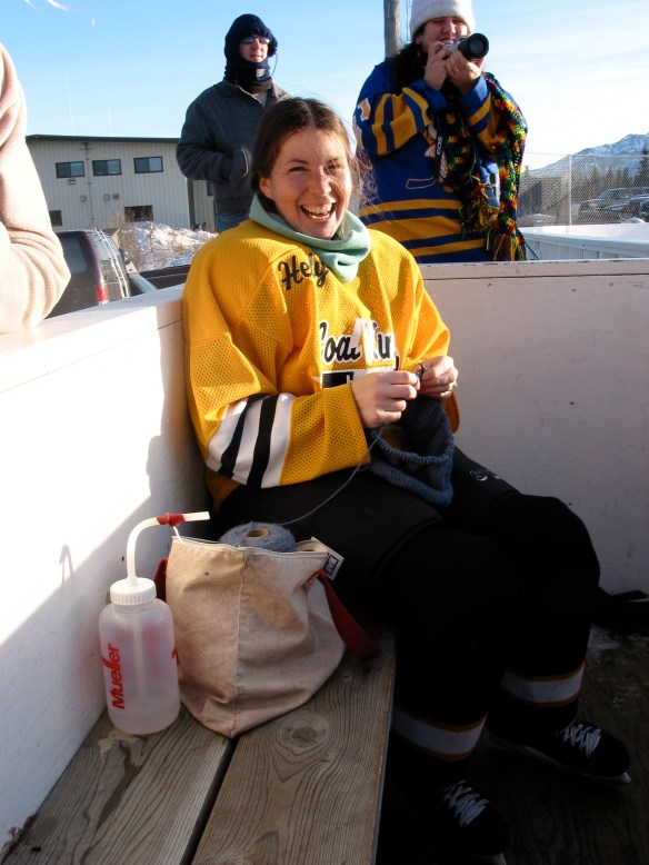 Knitting hats between hockey games, Healy, Alaska, 2003.