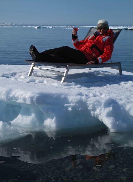 Elise Lockton takes a break from searching for polar bears in Iceland, sipping a cosmopolitan while lounging on an iceberg in her Carrie Cahill Mulligan embroidered felt hat.  