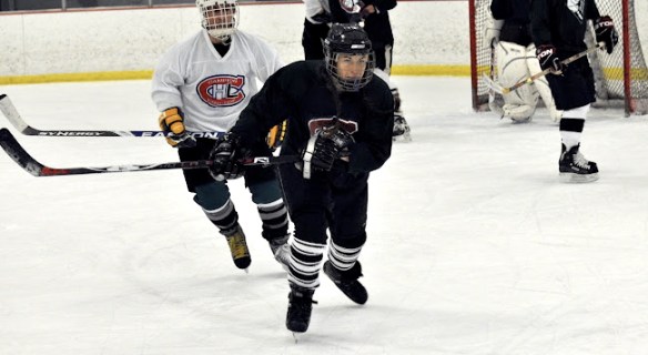 Carrie Cahill Mulligan skates hard after the puck in a Campion Hockey League game, Lebanon, New Hampshire, 2011.