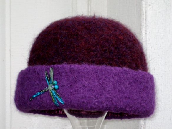 Carrie Cahill Mulligan's knitted felt hat #20 of 2012, purple with turquoise dragonfly ribbon embroidery.  