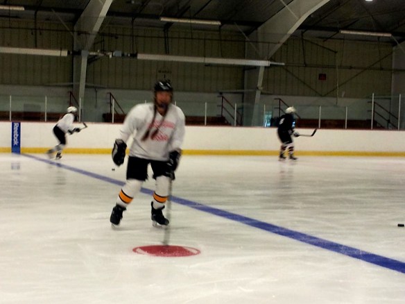 Carrie Cahill Mulligan retakes the ice at hockey boot camp just 3 days after removing her short-arm cast.