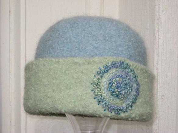 Icy Seafoam Mandala Embroidery Freehand embroidery of French knots on icy sea foam felt hat by fiber artist, Carrie Cahill Mulligan of Canaan, New Hampshire.