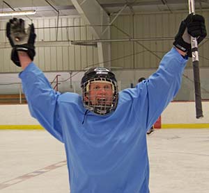 George Lightbody of Hanover, NH scores and raises his stick in victory... GOAL!