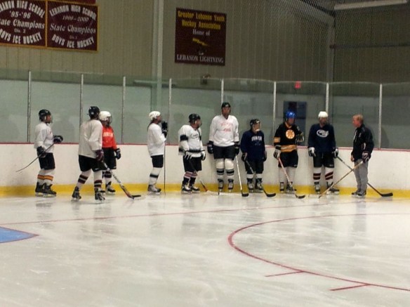 Coach Dodds explains a drill to Learn-to-Play adults at Campion Rink, Lebanon, New Hampshire.