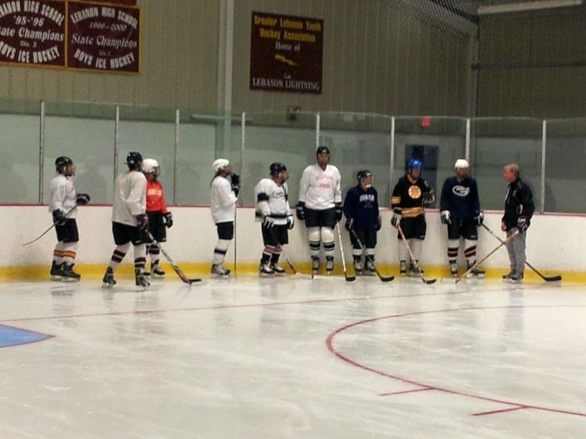 Coach Dodds explains a drill to Learn-to-Play adults at Campion Rink, Lebanon, New Hampshire.