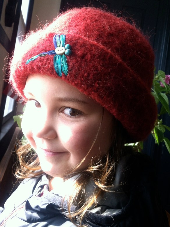 Harper models her prized dragonfly felt hat.
