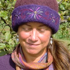 Vermont glass artist, Wendy Besett in her CCM felt hat with 3-Flower-Vine embroidery.