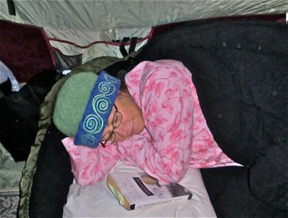 Glass artist, Wendy Besett of Hardwick, VT, camped out asleep at a fall craft show in her CCM felt hat.