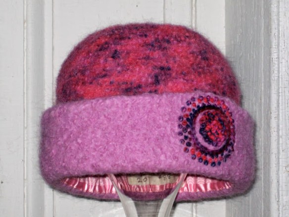 Freehand embroidery: Pink French Knot Mandala on pink felt hat, by felt hat fiber artist, Carrie Cahill Mulligan of Canaan, New Hampshire.