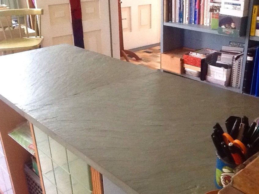 After a flurry of Spring Fever cleaning, the beautiful slate top of my office desk returns to view!