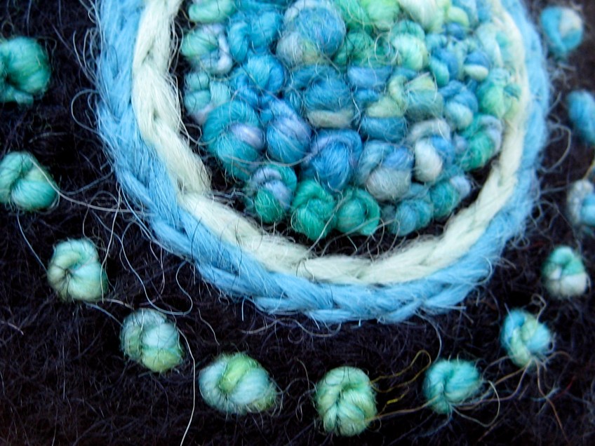 Detail of freehand french knot Mandala embroidery on felt hat, by NH fiber artist, Carrie Cahill Mulligan.